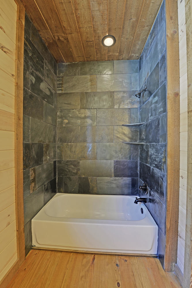 Design ideas for a medium sized rustic shower room bathroom in Atlanta with raised-panel cabinets, medium wood cabinets, a double shower, a two-piece toilet, black tiles, slate tiles, white walls, concrete flooring, a submerged sink, granite worktops, brown floors and an open shower.