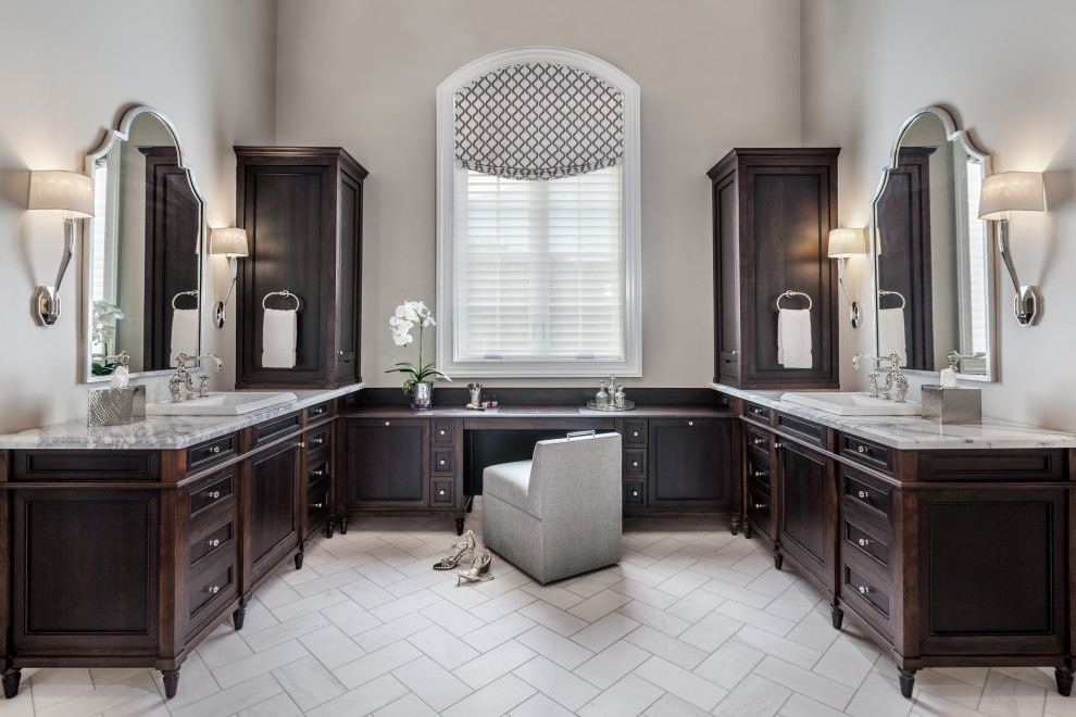 Example of a transitional master gray floor and double-sink bathroom design in Other with recessed-panel cabinets, dark wood cabinets, gray walls, a drop-in sink, gray countertops and a freestanding vanity