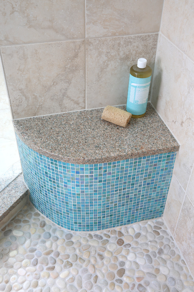 This is an example of a medium sized contemporary ensuite bathroom in Chicago with a corner shower, blue tiles, mosaic tiles, grey walls and pebble tile flooring.