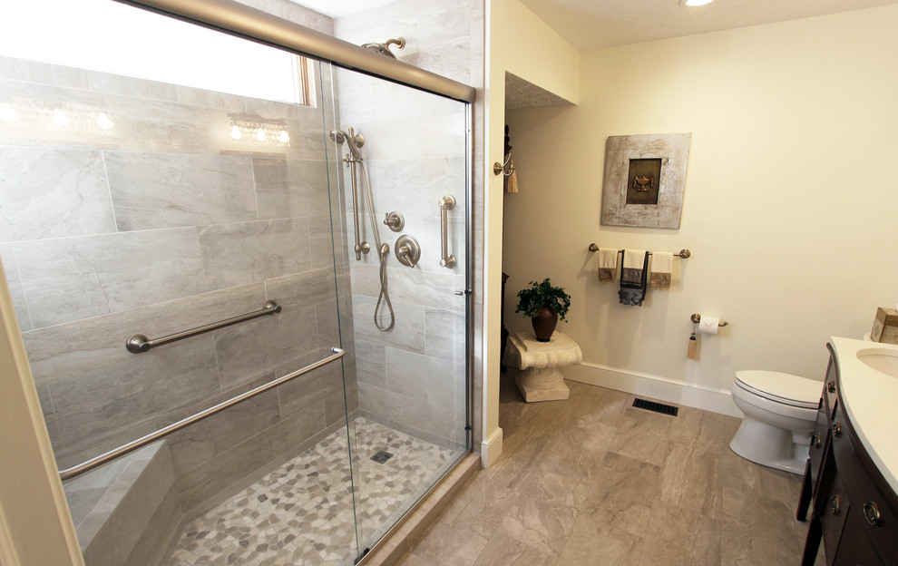 Example of a mid-sized classic master white tile and porcelain tile porcelain tile double shower design in Cleveland with dark wood cabinets, a two-piece toilet, beige walls, an undermount sink and quartz countertops