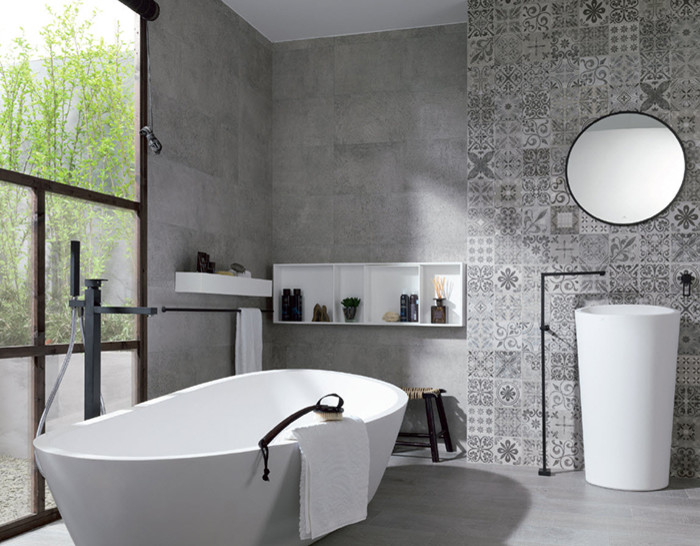 This is an example of a large contemporary ensuite bathroom in Denver with a pedestal sink, a freestanding bath, grey tiles, porcelain tiles, grey walls and porcelain flooring.