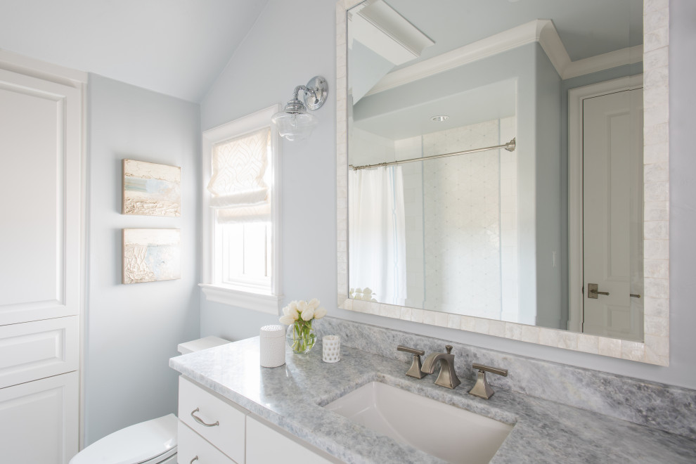 Inspiration for a large french country 3/4 white tile and ceramic tile single-sink bathroom remodel in Dallas with beaded inset cabinets, blue cabinets, gray walls, an undermount sink, marble countertops, gray countertops and a built-in vanity