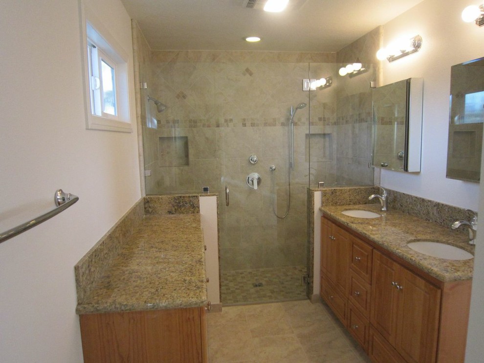 Inspiration for a large timeless master ceramic tile and beige floor alcove shower remodel in Orange County with an undermount sink, shaker cabinets, light wood cabinets, beige walls, granite countertops and a hinged shower door