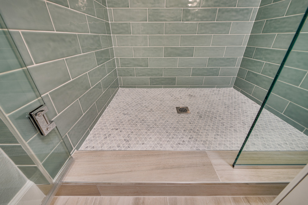 Inspiration for a mid-sized transitional kids' blue tile and subway tile porcelain tile and brown floor alcove shower remodel in Portland with raised-panel cabinets, white cabinets, a two-piece toilet, blue walls, an undermount sink, quartz countertops, a hinged shower door and white countertops