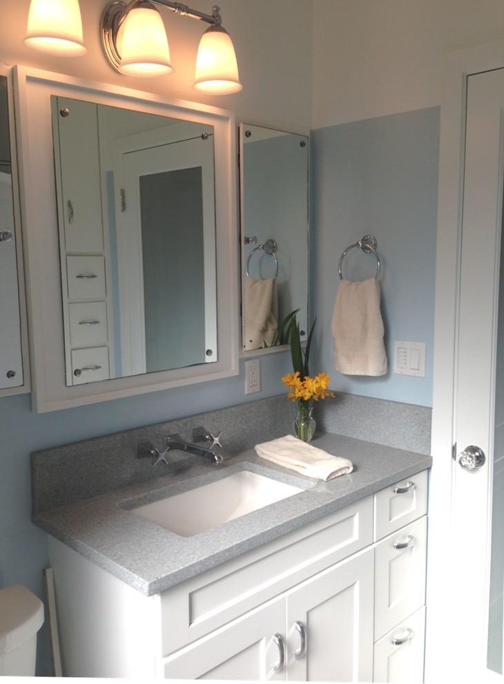 Small elegant master marble floor bathroom photo in Seattle with an undermount sink, recessed-panel cabinets, white cabinets, quartz countertops, a two-piece toilet and blue walls