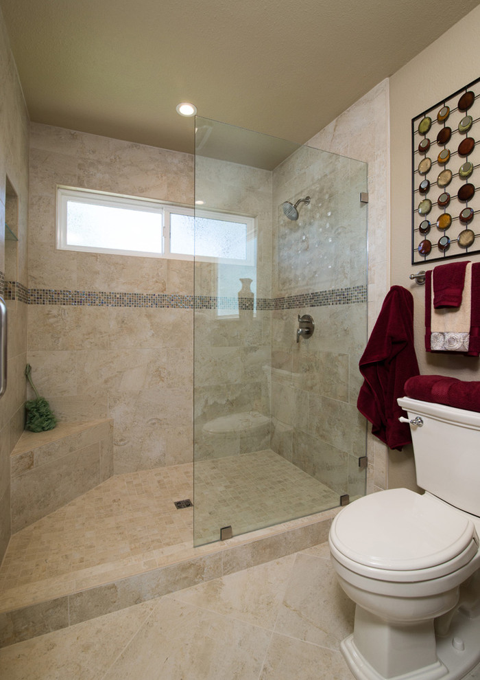 Mid-sized elegant 3/4 beige tile and stone tile bathroom photo in San Diego with an integrated sink, furniture-like cabinets, medium tone wood cabinets, granite countertops, a one-piece toilet and beige walls