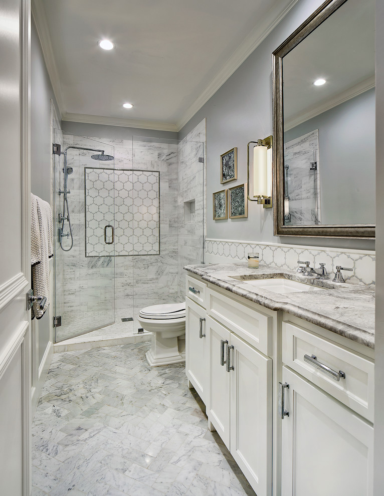 Inspiration for a mid-sized timeless 3/4 marble floor and multicolored floor alcove shower remodel in Dallas with gray walls, recessed-panel cabinets, white cabinets, a two-piece toilet, an undermount sink, quartzite countertops, a hinged shower door and multicolored countertops