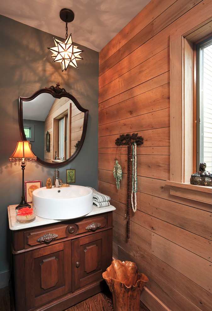 Inspiration for a rustic bathroom remodel in Chicago with a vessel sink