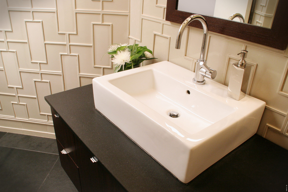Example of a small trendy white tile and ceramic tile slate floor and blue floor bathroom design in Cleveland with flat-panel cabinets, brown cabinets, a one-piece toilet, white walls, a vessel sink and soapstone countertops