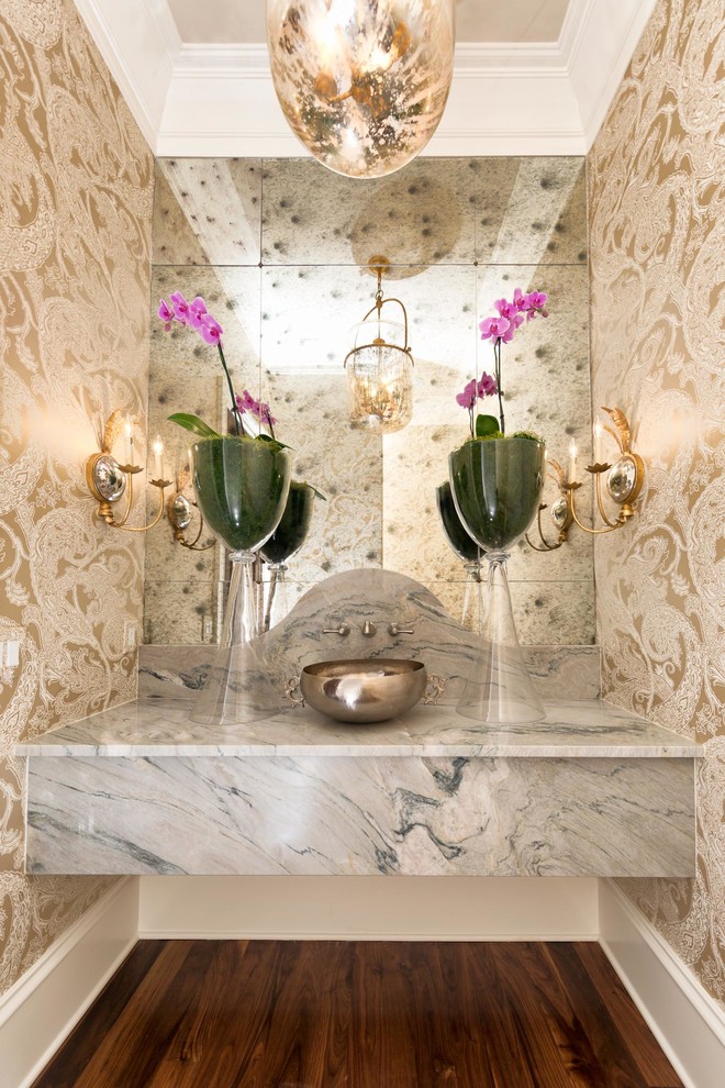 Photo of a small mediterranean cloakroom in Nashville with a two-piece toilet, beige walls, dark hardwood flooring, a vessel sink, marble worktops and brown floors.