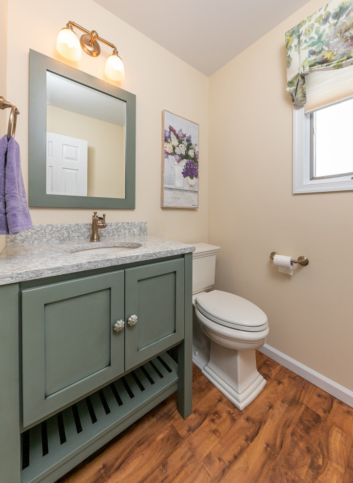 Small classic bathroom in Philadelphia with freestanding cabinets, green cabinets, a submerged sink, brown floors and multi-coloured worktops.
