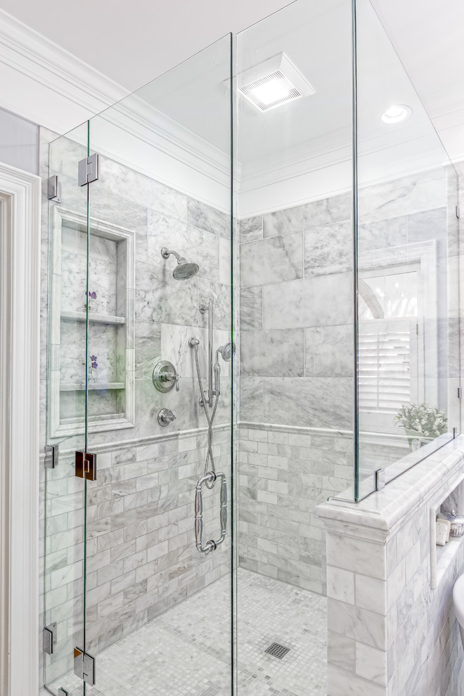 This is an example of a large classic ensuite bathroom in Columbus with beaded cabinets, white cabinets, a freestanding bath, a built-in shower, grey tiles, marble tiles, grey walls, marble flooring, a submerged sink, marble worktops, grey floors, a hinged door and white worktops.