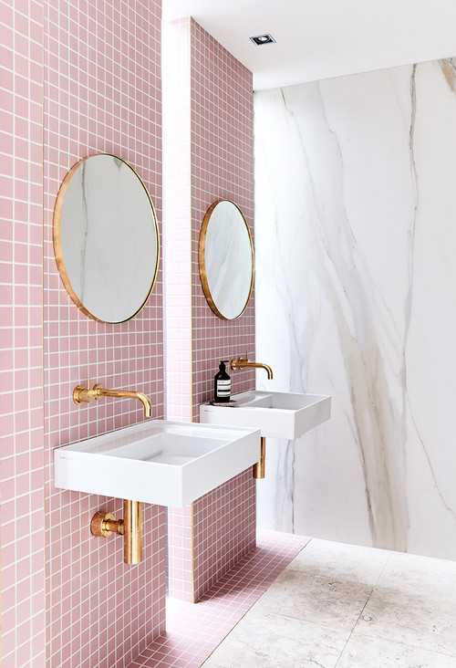 Modern Bathroom with Pink Accent Wall and Gold Details 