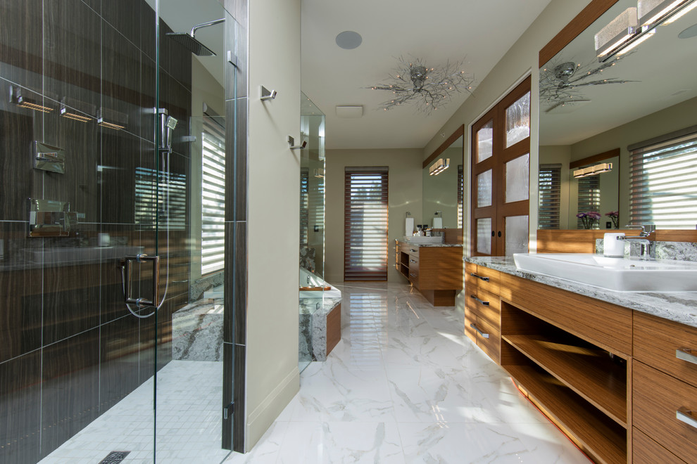 Medium sized contemporary ensuite bathroom in Vancouver with flat-panel cabinets, medium wood cabinets, a built-in bath, a walk-in shower, green walls, black tiles, porcelain tiles, marble flooring, granite worktops, white floors, a hinged door and a vessel sink.