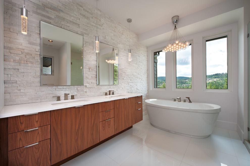 Design ideas for a contemporary bathroom in Vancouver with stone tiles.