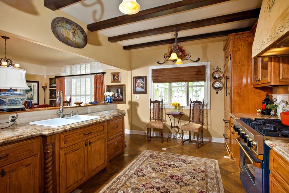 This is an example of a medium sized modern kitchen in San Diego with light wood cabinets.