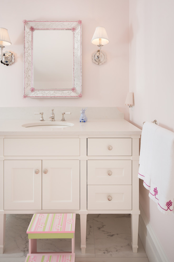 Design ideas for a large traditional family bathroom in Atlanta with recessed-panel cabinets, beige cabinets, an alcove shower, a two-piece toilet, pink walls, marble flooring, a submerged sink, engineered stone worktops, grey floors and a hinged door.