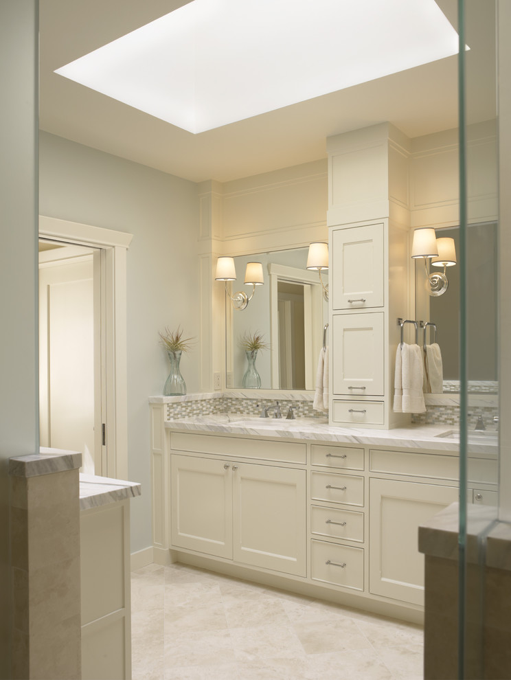 Example of a classic bathroom design in San Francisco with marble countertops