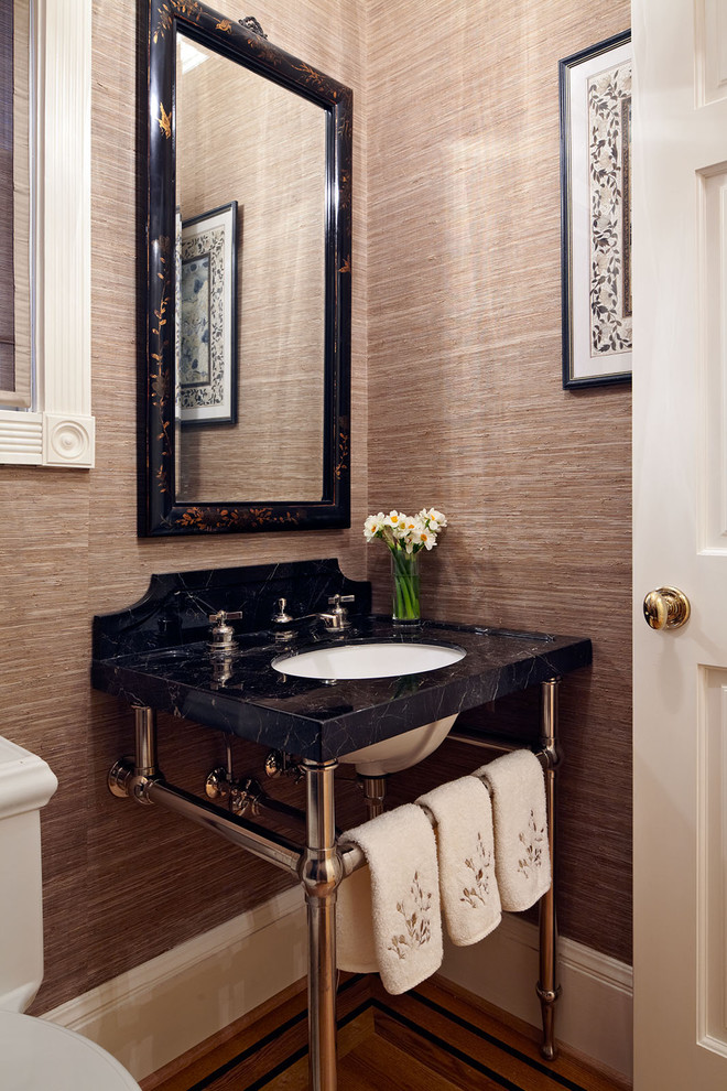 Elegant bathroom photo in San Francisco with a console sink and brown walls