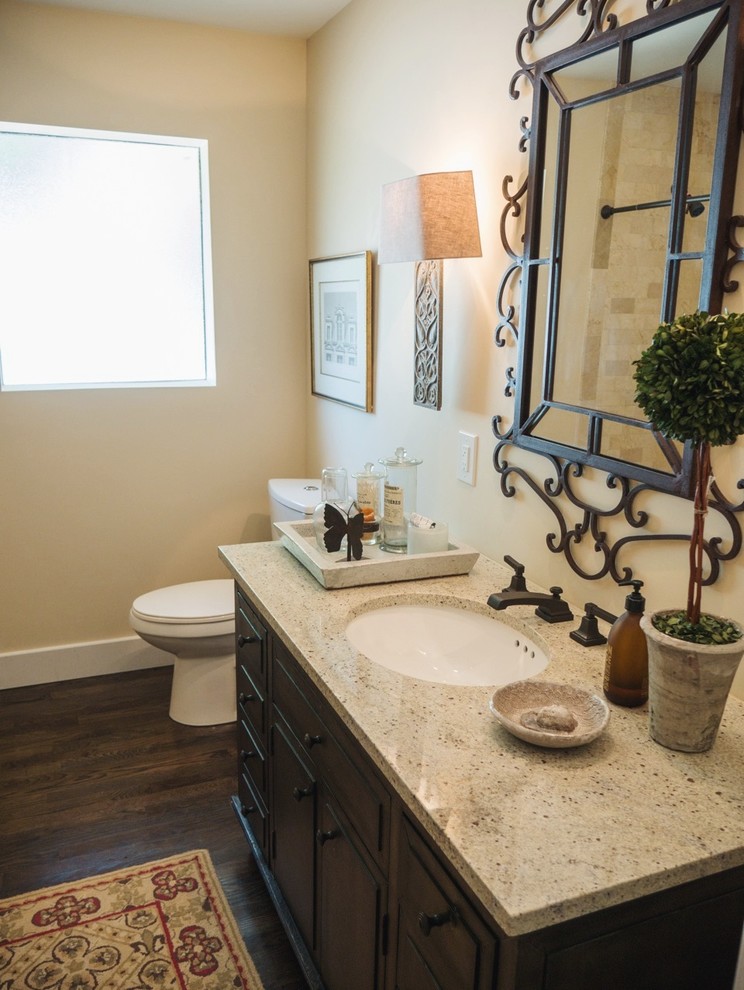 Mid-sized transitional beige tile and ceramic tile dark wood floor doorless shower photo in Dallas with an undermount sink, furniture-like cabinets, gray cabinets, granite countertops, a one-piece toilet and beige walls