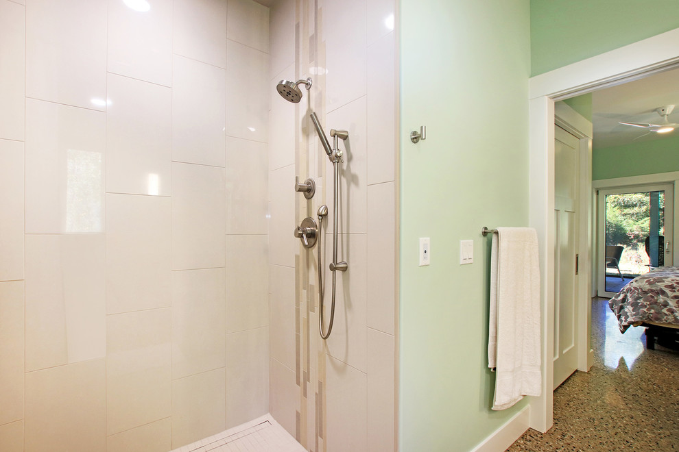 Inspiration for a large mid-century modern master beige tile and ceramic tile concrete floor and gray floor bathroom remodel in Grand Rapids with recessed-panel cabinets, light wood cabinets, a two-piece toilet, green walls, an undermount sink, quartz countertops and gray countertops