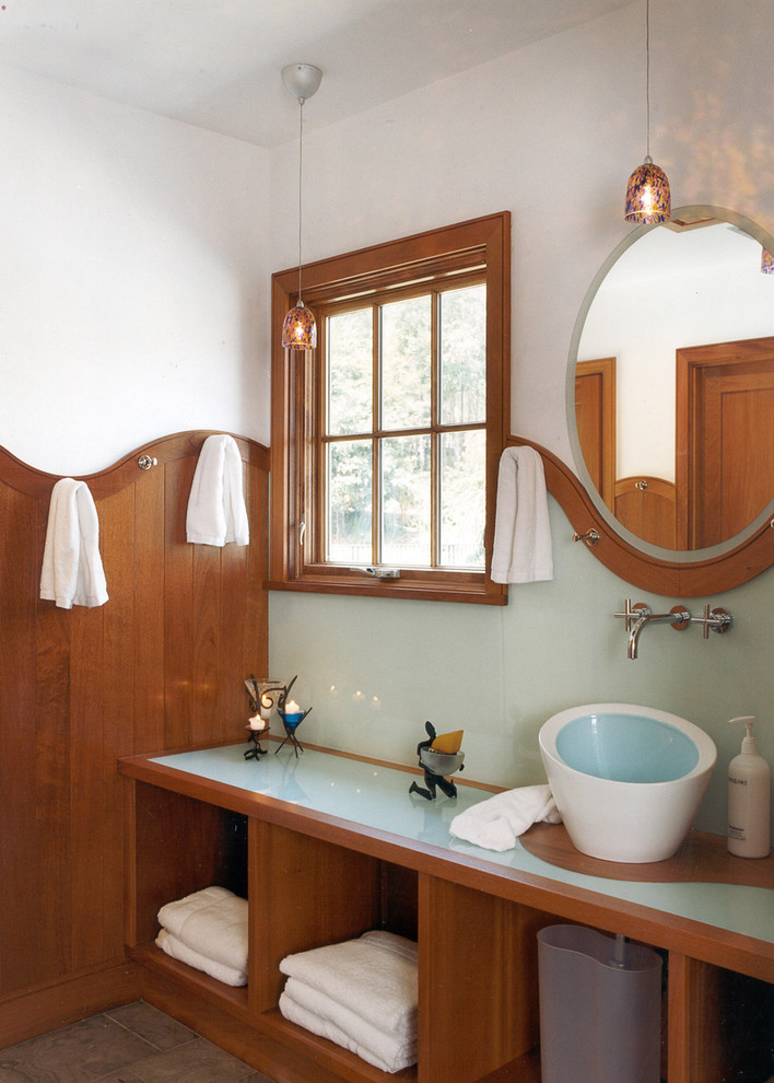This is an example of a modern bathroom in Boston with a vessel sink, open cabinets and medium wood cabinets.