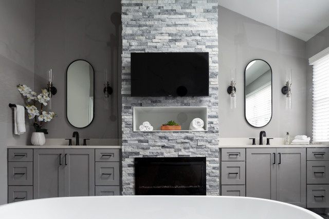 bathroom with fireplace and tv