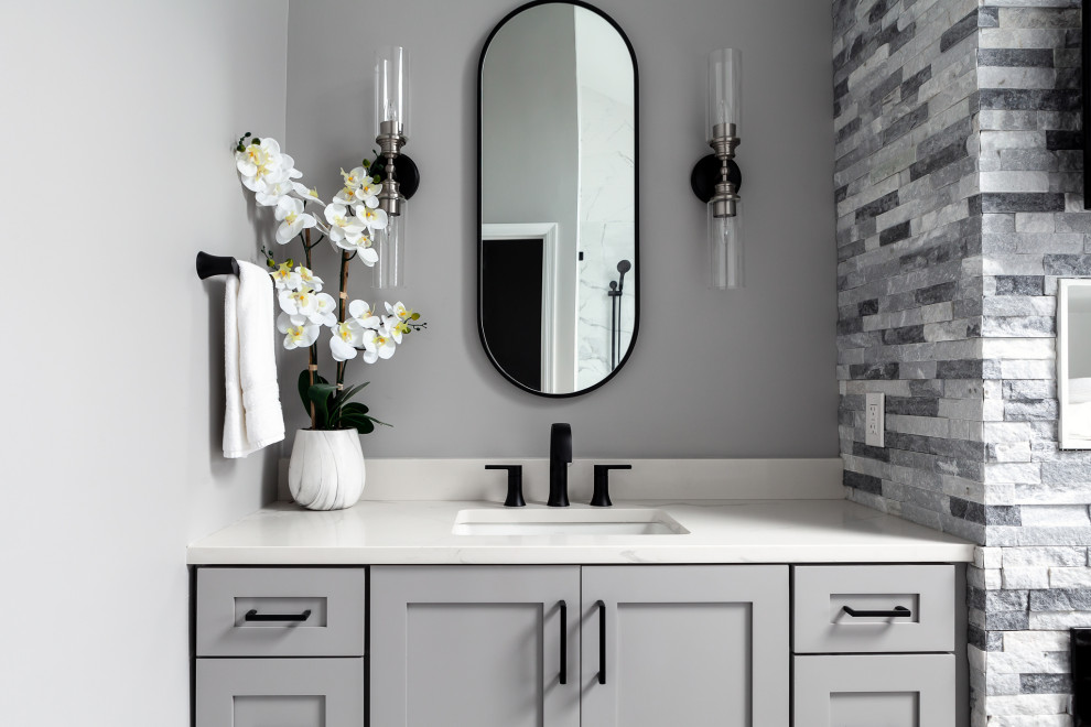 Bathroom - large modern master porcelain tile, gray floor, double-sink and vaulted ceiling bathroom idea in Philadelphia with recessed-panel cabinets, gray cabinets, a two-piece toilet, gray walls, an undermount sink, quartzite countertops, a hinged shower door, white countertops and a built-in vanity