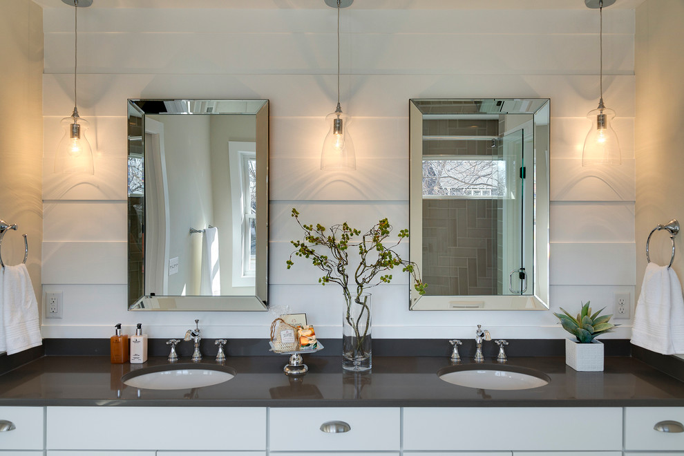 This is an example of a beach style bathroom in Minneapolis with flat-panel cabinets, white cabinets, beige tiles, beige walls, a submerged sink and grey worktops.