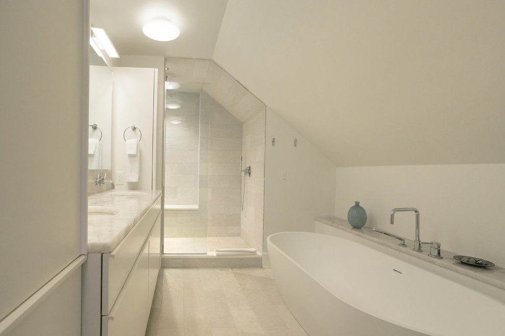Photo of a medium sized contemporary ensuite bathroom in Philadelphia with flat-panel cabinets, white cabinets, quartz worktops and multi-coloured worktops.