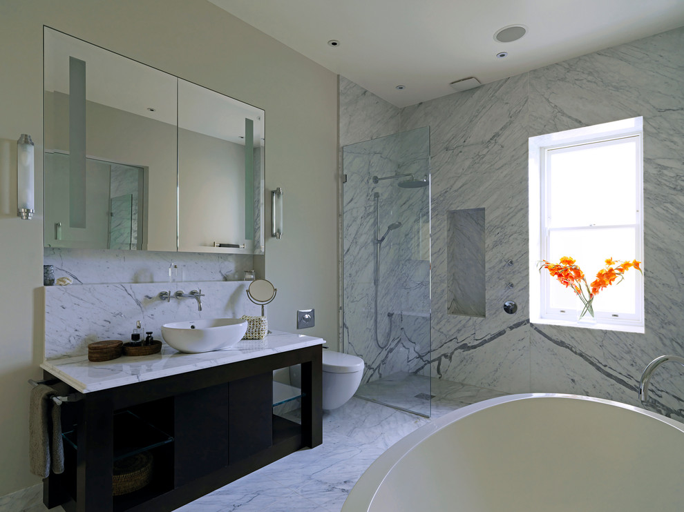 This is an example of a contemporary bathroom in London with a vessel sink.