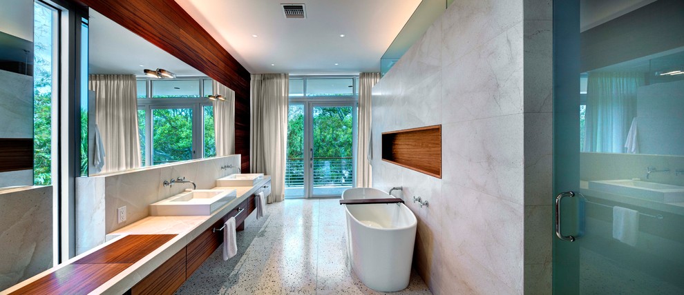 Design ideas for a modern bathroom in Tampa with a freestanding bath and a vessel sink.