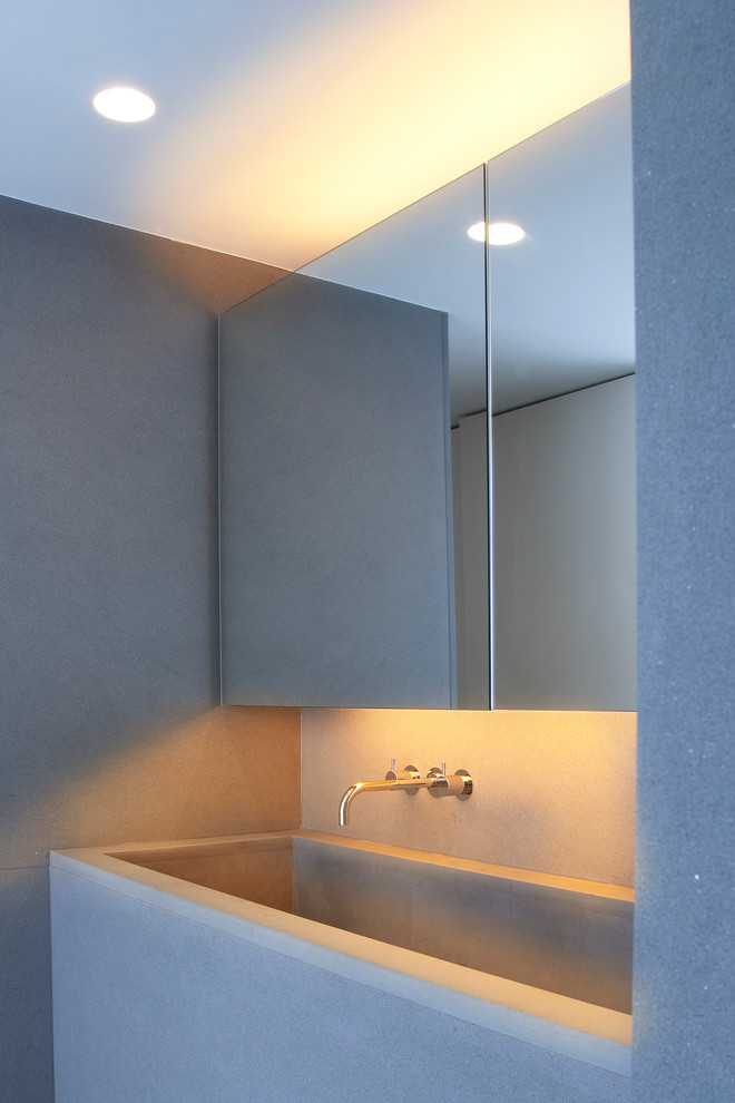 Modelo de cuarto de baño minimalista con lavabo integrado