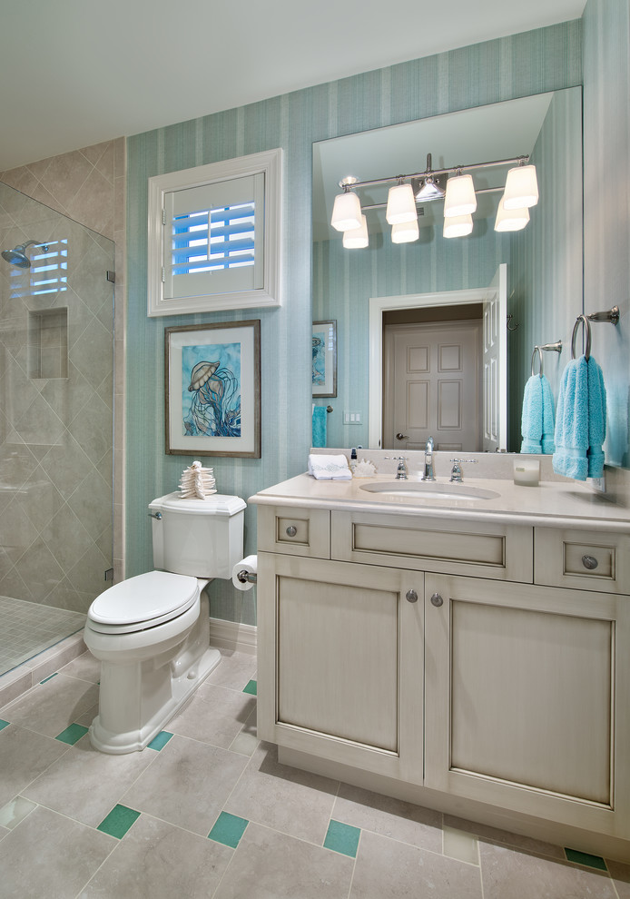 Small beach style kids' beige tile and ceramic tile ceramic tile alcove shower photo in Miami with an undermount sink, shaker cabinets, gray cabinets, granite countertops, a two-piece toilet and green walls