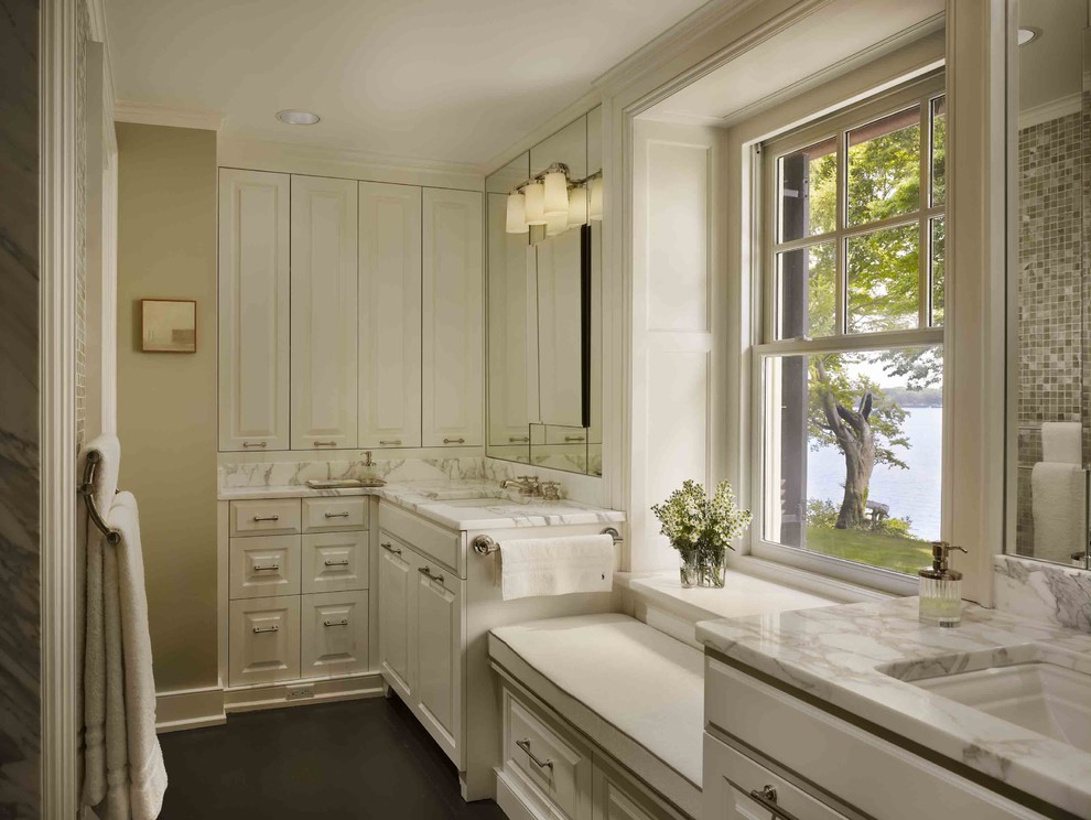 Design ideas for a medium sized classic ensuite bathroom in Philadelphia with raised-panel cabinets, white cabinets, multi-coloured walls, a submerged sink and marble worktops.