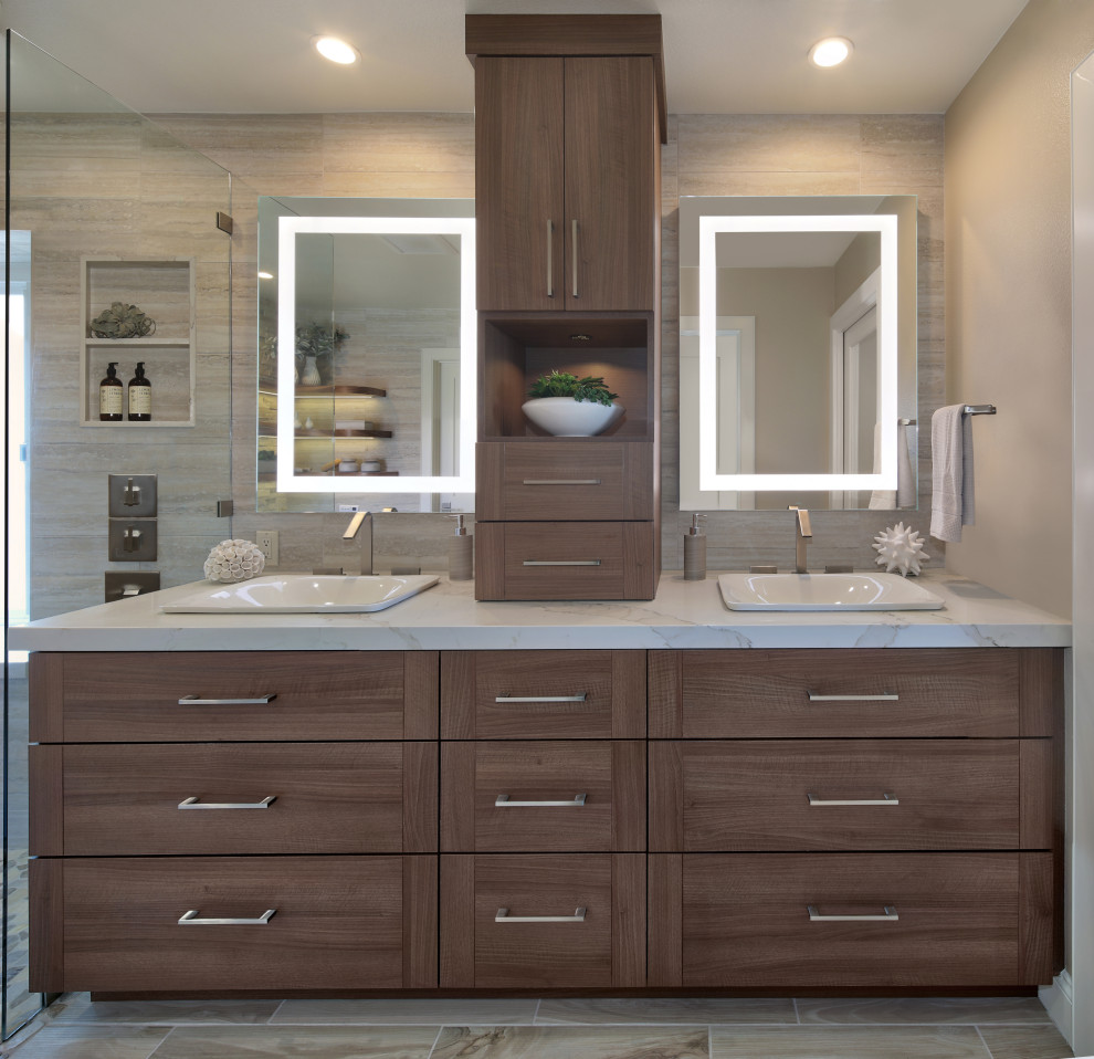 Design ideas for a large contemporary shower room bathroom in Orange County with flat-panel cabinets, medium wood cabinets, beige tiles, porcelain tiles, beige walls, porcelain flooring, a built-in sink, multi-coloured floors, grey worktops, a wall niche, double sinks and a built in vanity unit.