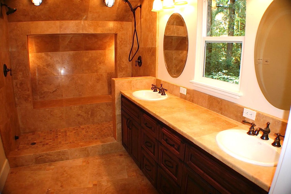 This is an example of a medium sized mediterranean ensuite bathroom in San Francisco with raised-panel cabinets, dark wood cabinets, an alcove shower, beige tiles, travertine tiles, white walls, travertine flooring, a built-in sink, tiled worktops, beige floors and an open shower.