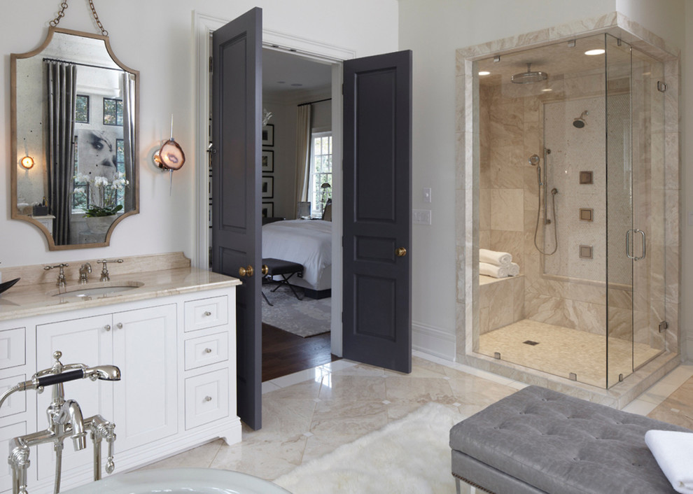 Example of a large classic master beige tile marble floor bathroom design in New York with an undermount sink, recessed-panel cabinets, white cabinets, marble countertops and white walls