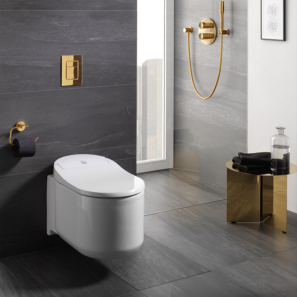 Idées déco pour une salle de bain contemporaine avec une douche à l'italienne, WC suspendus et un sol gris.