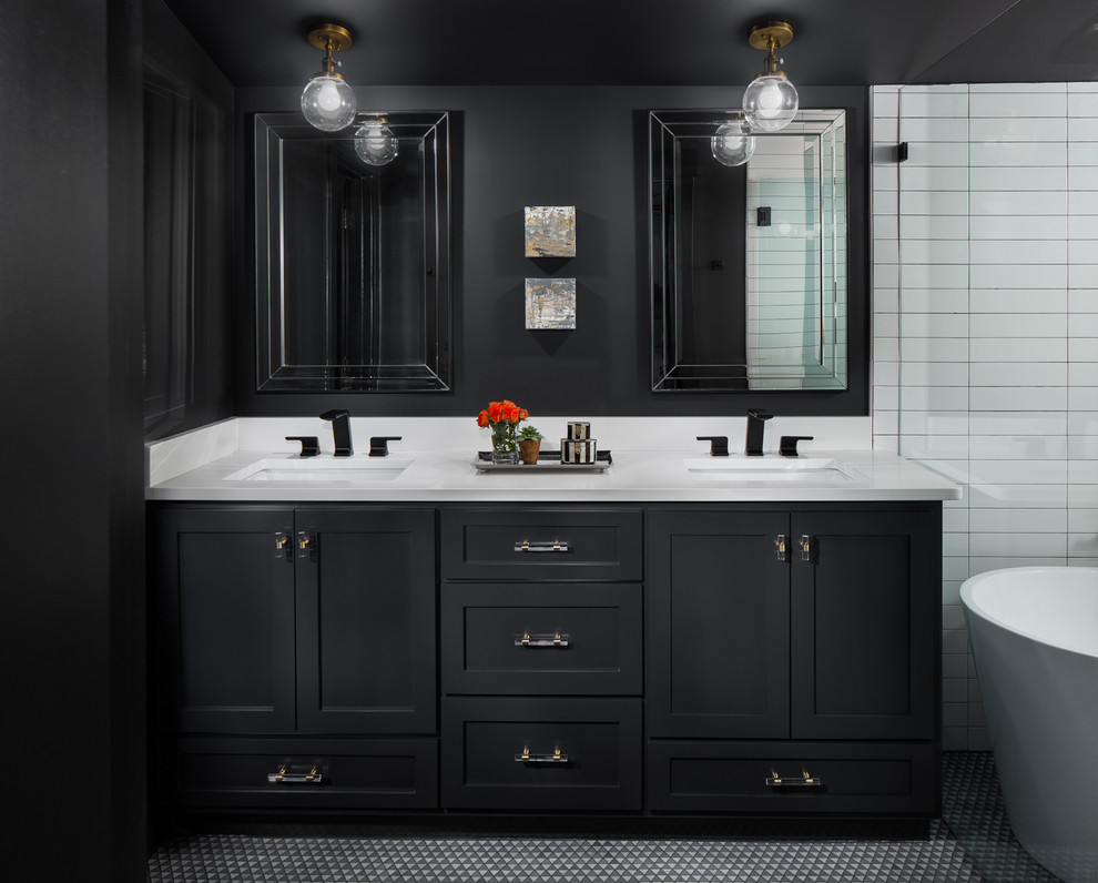 Inspiration for a small transitional master white tile and ceramic tile ceramic tile and gray floor bathroom remodel in Birmingham with recessed-panel cabinets, black cabinets, a two-piece toilet, black walls, an undermount sink, quartz countertops, a hinged shower door and white countertops