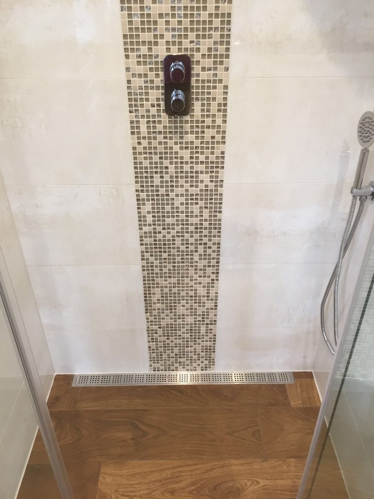 Photo of a medium sized contemporary shower room bathroom in Hampshire with white cabinets, a walk-in shower, yellow tiles, ceramic tiles, porcelain flooring, a console sink and solid surface worktops.