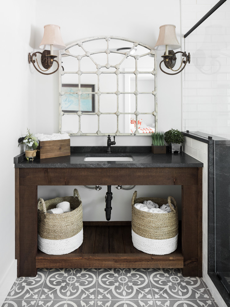 Example of an eclectic gray floor bathroom design in Birmingham with dark wood cabinets, white walls and an undermount sink