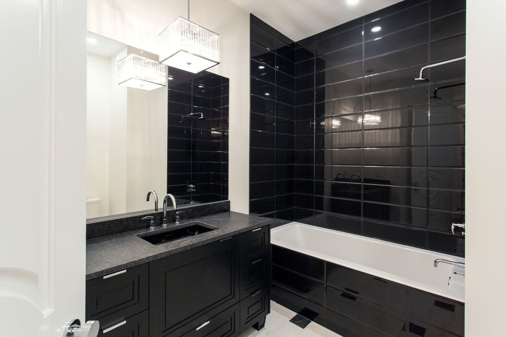 Inspiration for a large timeless 3/4 black tile and ceramic tile bathroom remodel in Other with recessed-panel cabinets, black cabinets, white walls, an undermount sink and granite countertops