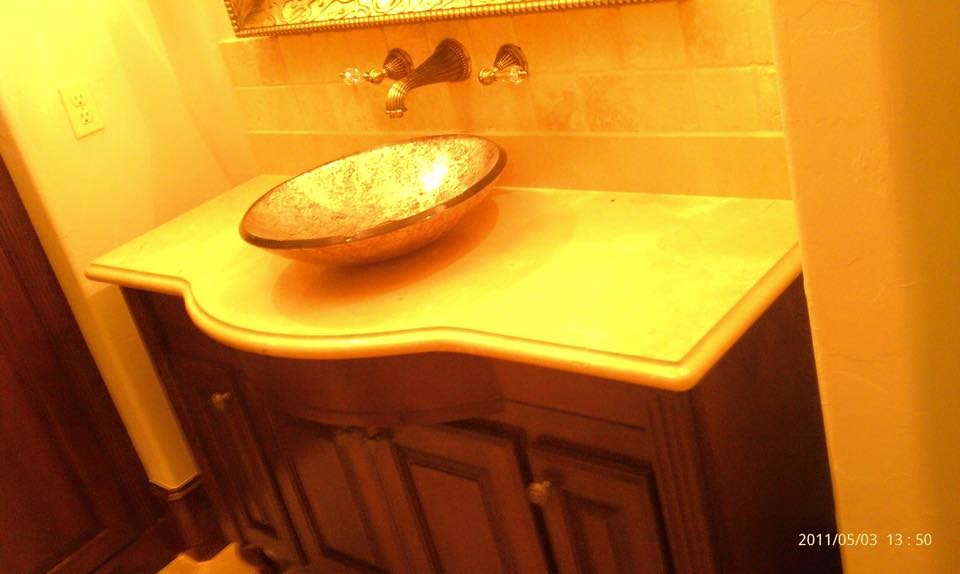 Mid-sized elegant beige tile and ceramic tile ceramic tile bathroom photo in Houston with a vessel sink, raised-panel cabinets, medium tone wood cabinets, granite countertops and beige walls