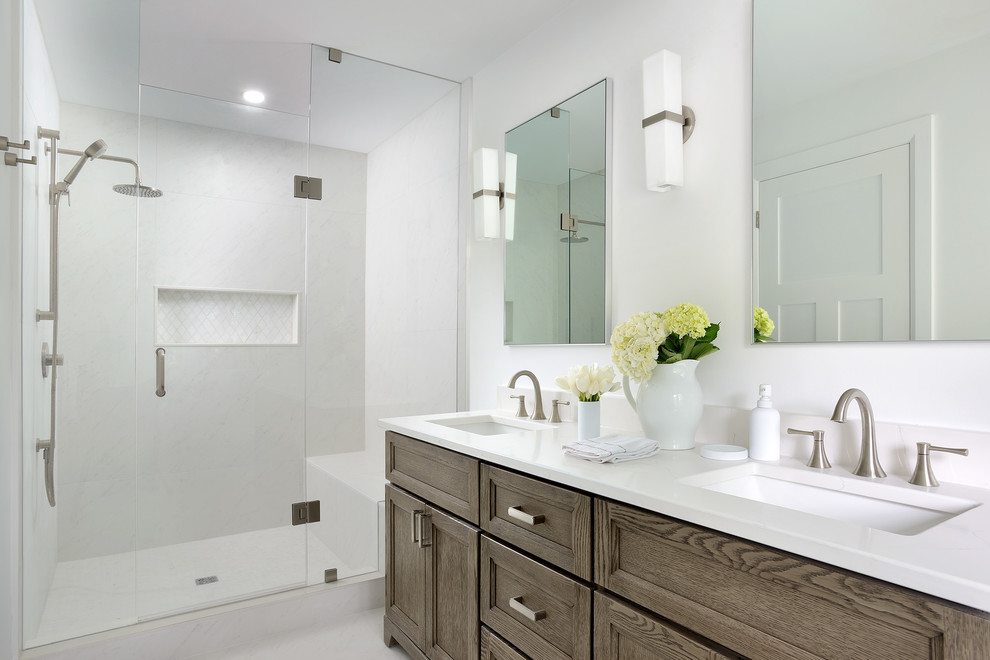 Inspiration for a contemporary bathroom in Toronto with flat-panel cabinets, white cabinets, a walk-in shower, white tiles, porcelain tiles, white walls, a submerged sink, engineered stone worktops, a hinged door and white worktops.