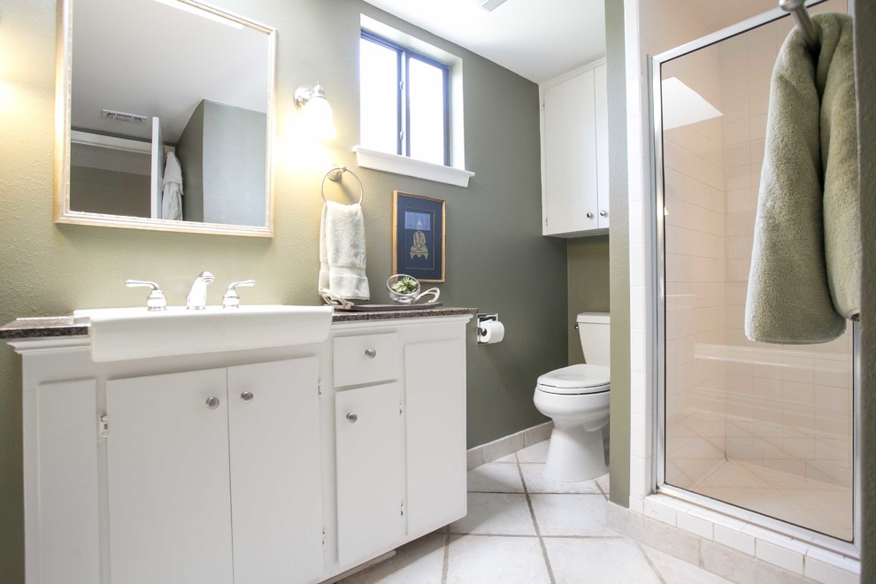 Small elegant 3/4 white tile and ceramic tile ceramic tile alcove shower photo in Austin with furniture-like cabinets, white cabinets, a two-piece toilet, green walls, a drop-in sink and granite countertops