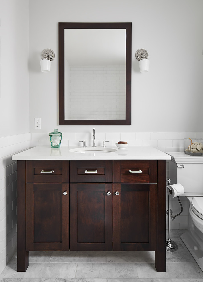 Example of a transitional white tile and subway tile gray floor and marble floor bathroom design in Other with dark wood cabinets, a two-piece toilet, gray walls, white countertops and shaker cabinets