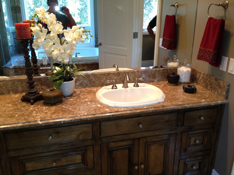 Medium sized traditional bathroom in Orange County with recessed-panel cabinets, dark wood cabinets, a built-in bath, a built-in sink and terrazzo worktops.