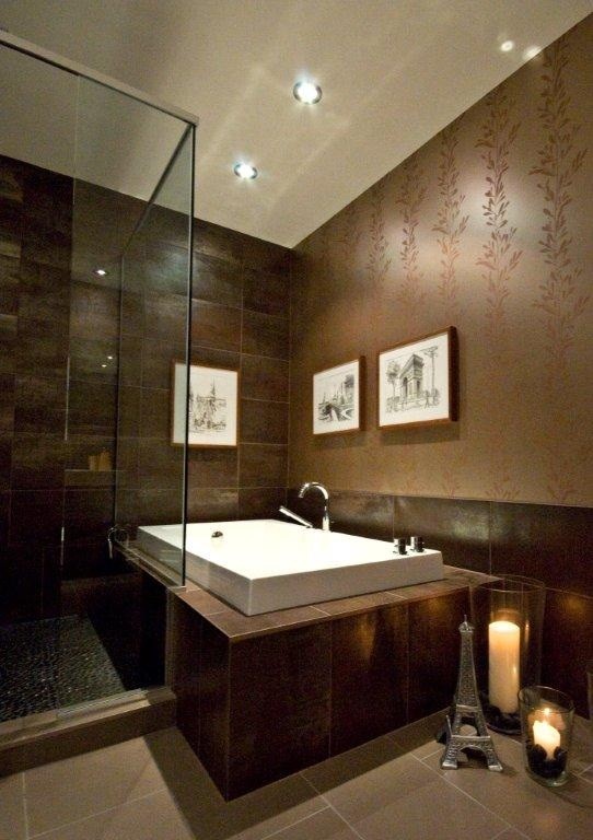 Bathroom - mid-sized contemporary master brown tile and porcelain tile porcelain tile bathroom idea in Montreal with an integrated sink, medium tone wood cabinets, quartzite countertops and a one-piece toilet