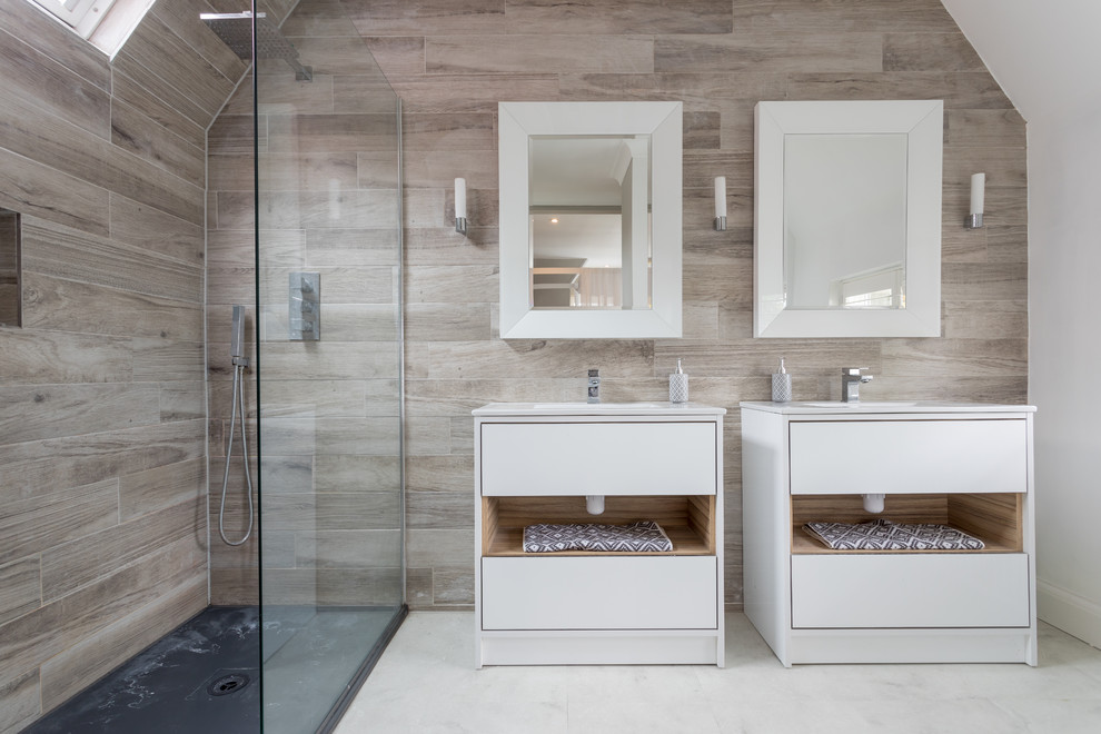 Alcove shower - contemporary master brown tile white floor alcove shower idea in Sussex with flat-panel cabinets, white cabinets, an undermount sink and white countertops